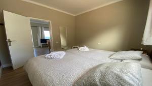 a bedroom with a bed with two towels on it at Casa Camilo I in Valle Gran Rey