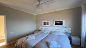 a bedroom with a bed with two towels on it at Casa Camilo I in Valle Gran Rey