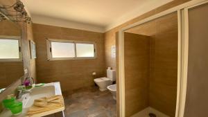 a bathroom with a shower and a sink and a toilet at Casa Camilo I in Valle Gran Rey