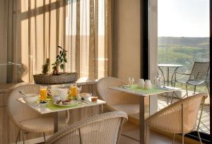 ห้องอาหารหรือที่รับประทานอาหารของ Le Panoramic