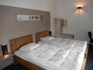 Postel nebo postele na pokoji v ubytování Gîte du Moulin - Rose