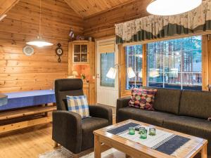 Posezení v ubytování Holiday Home Nurmennunnu by Interhome + 14 fotografií
