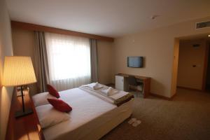 Postel nebo postele na pokoji v ubytování Trakya City Hotel