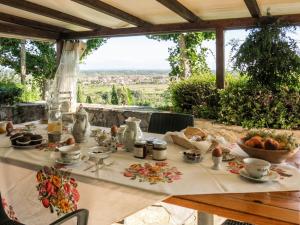 a table with a table cloth with food on it at Holiday Home Maestraccio by Interhome in Buti