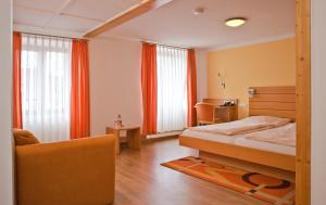 Postel nebo postele na pokoji v ubytování Gartenhotel Feldeck