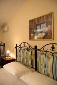 Кровать или кровати в номере Tavernola - Locanda Di Campagna