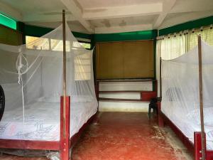 Ένα ή περισσότερα κρεβάτια σε δωμάτιο στο Hostal El Chileno Sapzurro