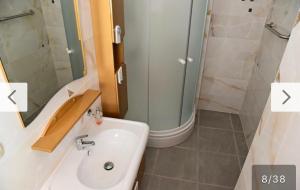 a bathroom with a sink and a shower at Villa D in Trogir