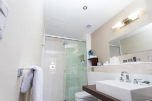 
a bathroom with a sink, toilet and shower at Stannum Boutique Hotel & Spa in La Paz
