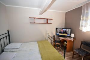 Posteľ alebo postele v izbe v ubytovaní siodemka
