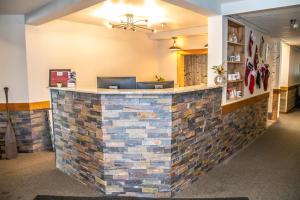 a lobby with a brick wall at Mountain Inn at Lutsen in Lutsen