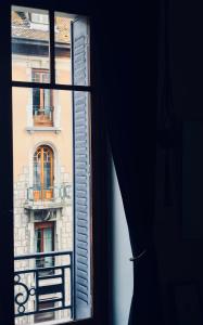 a view of a building from a window at L’Appartement des Glières Annecy centre in Annecy +1 photo