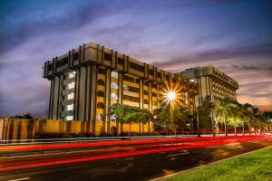 a building on the side of a street at night at Clarion Inn & Suites Miami International Airport in Miami