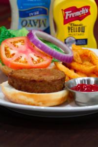 a plate of food with a sandwich and french fries at Clarion Inn & Suites Miami International Airport in Miami
