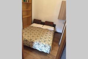 Ein Bett oder Betten in einem Zimmer der Unterkunft Nel set di piccolo mondo antico Villa Viola