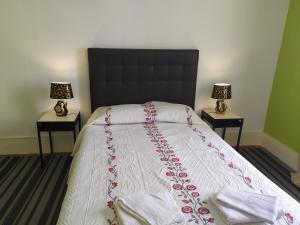 En eller flere senge i et værelse på Cenário Catita Hostel
