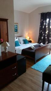 a bedroom with two beds with blue pillows at Apartments Zeneral in Novalja