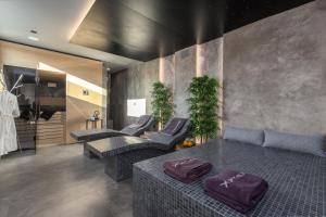 Televízia a/alebo spoločenská miestnosť v ubytovaní Villa Vie