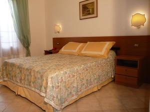 Postel nebo postele na pokoji v ubytování Hotel Astor Victoria