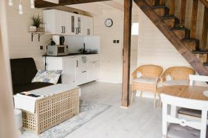 a living room with a couch and a table at Eko Domek w górach in Korbielów