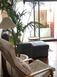 a living room with a couch and a chair at Vacations home Albufeira in Albufeira