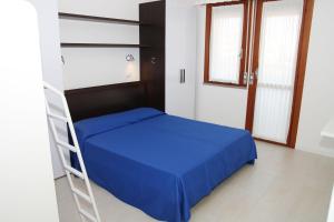 Postel nebo postele na pokoji v ubytování Residence Equilio Family Apartments