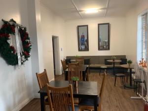 a dining room with tables and chairs and christmas decorations at Hotel Koorawatha in Koorawatha