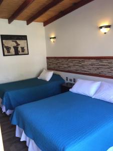 Postel nebo postele na pokoji v ubytování Hostal Puritama