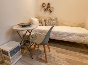 A bed or beds in a room at Naxos Enjoy Apartments