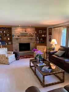 a living room with a couch and a coffee table at Private Guest Bedroom-1W West Room - Close to Lake Michigan in Sheboygan