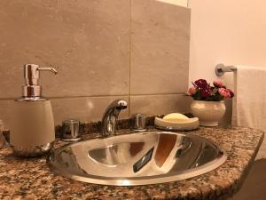 a bathroom sink with a faucet on a counter at Dpto El Monumento in Concepción del Uruguay