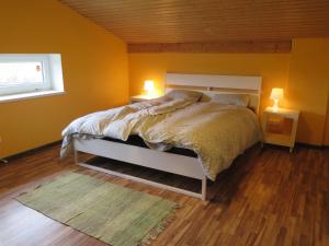 Postel nebo postele na pokoji v ubytování Holiday House Koceri