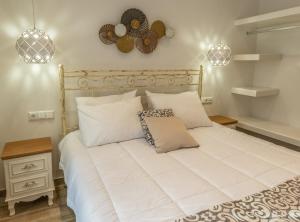 A bed or beds in a room at Naxos Enjoy Apartments