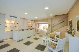 a large kitchen with a checkered floor at Iberostar Selection Royal El Mansour in Mahdia
