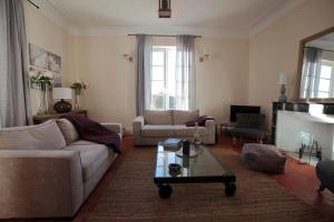 a living room with a couch and a coffee table at La Maison R in Pignans