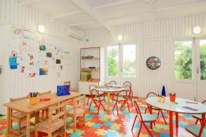 a classroom with tables and chairs in a room at Iberostar Selection Royal El Mansour in Mahdia