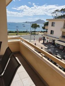 a balcony of a building with a view of the ocean at Bay Village - Shoal Bay Apartments in Shoal Bay