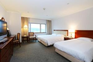 Gulta vai gultas numurā naktsmītnē Evergreen Laurel Hotel - Keelung