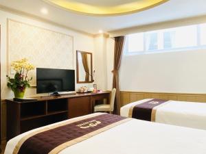 Ένα ή περισσότερα κρεβάτια σε δωμάτιο στο Roy Dala Hotel