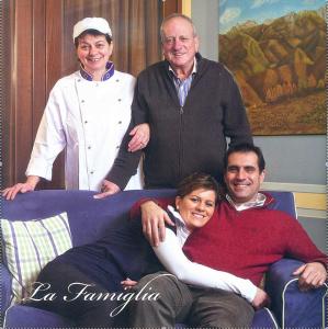 a man and a woman sitting on a couch at Hotel Ristorante La Lanterna in Castelnuovo di Garfagnana