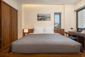 Postel nebo postele na pokoji v ubytování Avenis Hotel