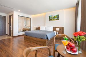 Postel nebo postele na pokoji v ubytování Avenis Hotel