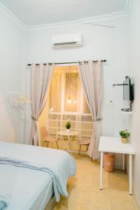 Postel nebo postele na pokoji v ubytování Ministry Homestay
