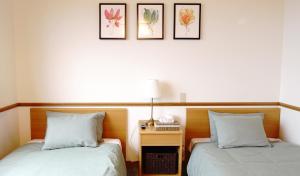 Postel nebo postele na pokoji v ubytování Refre Hotel