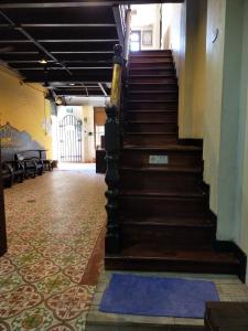 a staircase in a building with a carpeted floor at Phuket Sunny Hostel in Phuket