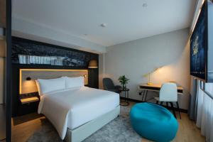 Postel nebo postele na pokoji v ubytování Park Inn by Radisson Shanghai Huanqiugang