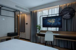 Postel nebo postele na pokoji v ubytování Park Inn by Radisson Shanghai Huanqiugang