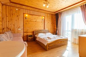 Postel nebo postele na pokoji v ubytování Zeleniy Bir