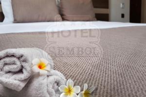 A bed or beds in a room at Sembol Hotel