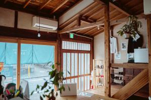 a room with a large window with a view of a boat at Fukuoka Guesthouse SHIP in Fukuoka